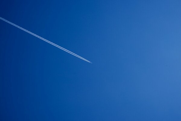 The sky and the flying plane minimalism