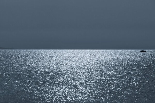 Silver ripples on the night sea