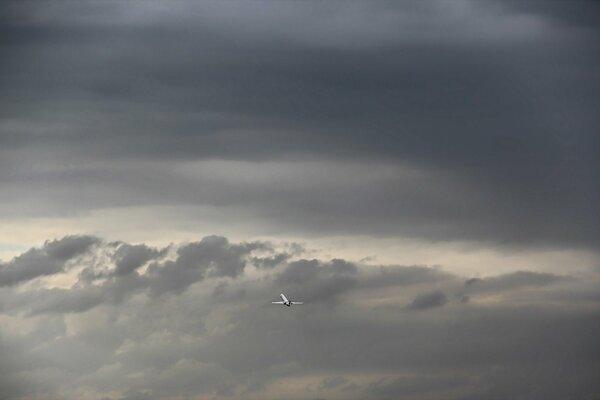 Flying an airplane through a cloudy sky