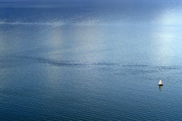 A lonely yacht in the blue sea