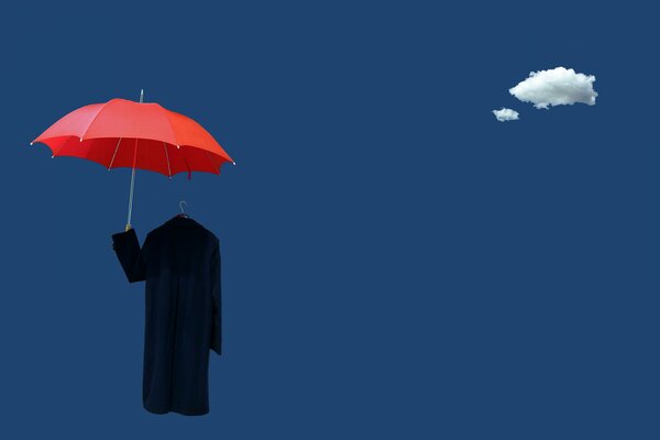 A red umbrella and a black coat on a hanger