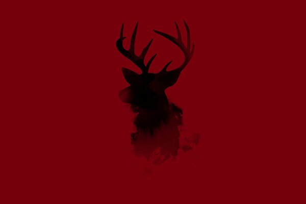 Silhouette de cerf sur fond rouge