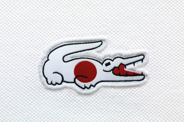 The flag of Japan on the crocodile Lacoste