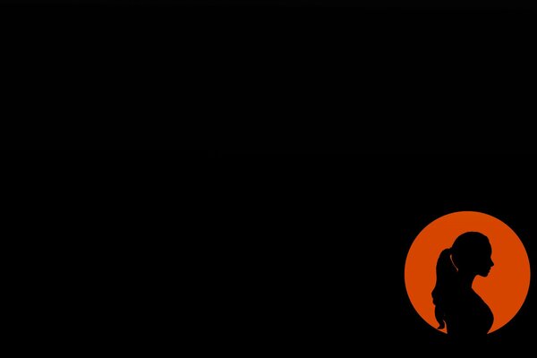 Silhouette eines Mädchens auf dunklem Hintergrund in einem orangefarbenen Kreis