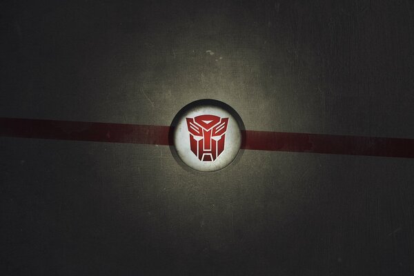 Logo Transformers su sfondo grigio