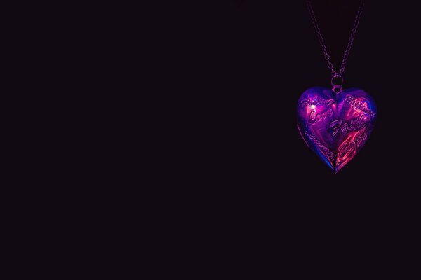 Heart-shaped pendant on a black background