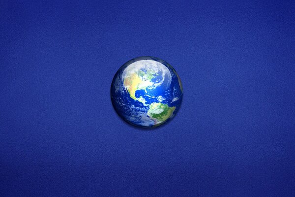 Minimalism. Planet earth on a blue background