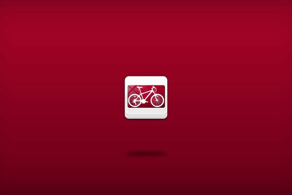 Miniature bike on a red background