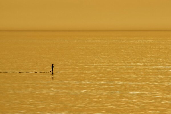 Image of a man in the middle of the sea