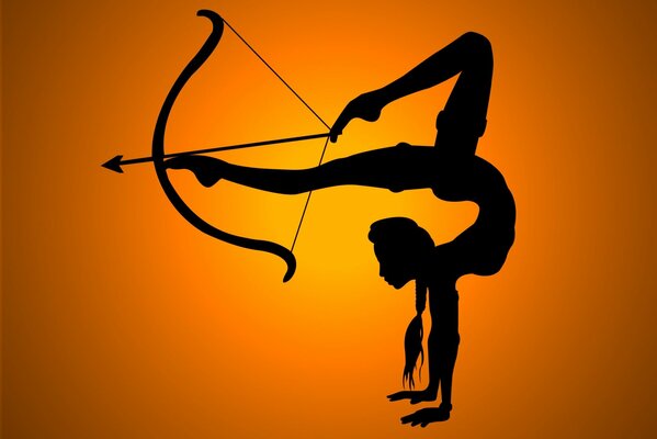 A flexible girl holds a bow with her legs