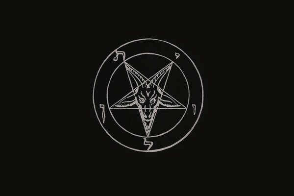 An ominous image of a pentagram on a black background