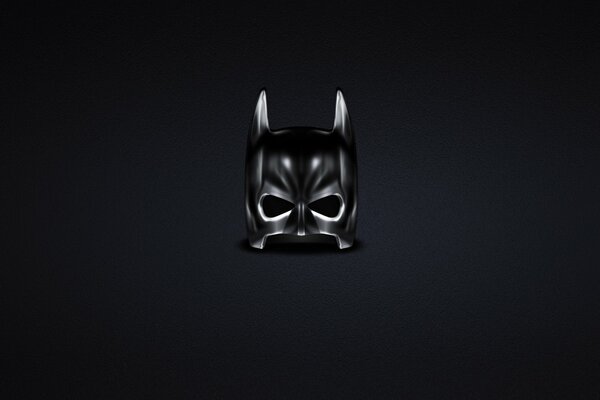 Black Batman mask on a dark background