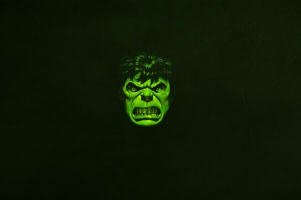 The evil face of the Hulk on a black background