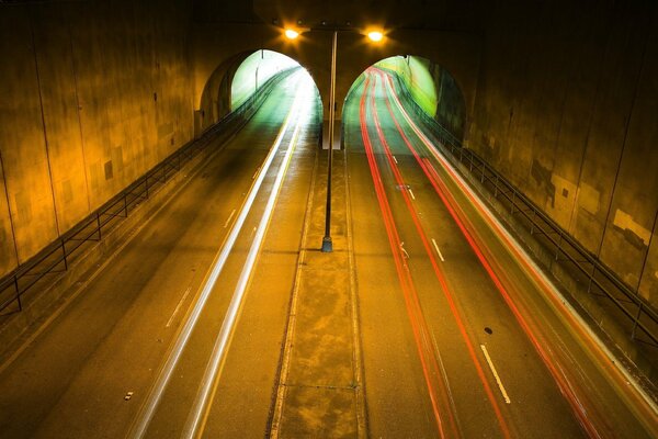 Multicolored lights flash through the tunnel