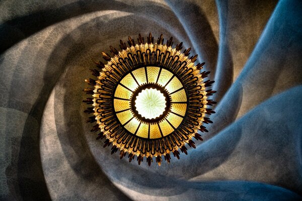 Yellow chandelier in the center of the spiral