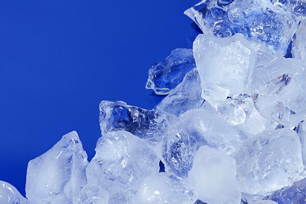 Chunks of crushed ice on a blue background