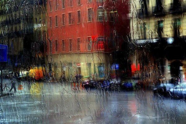 City street through rain-drenched glass