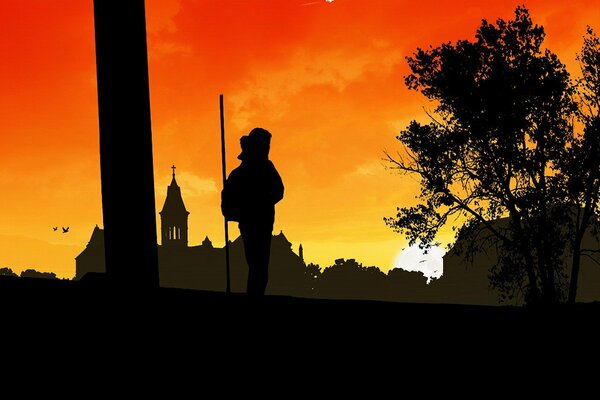 The silhouette of a traveler against the sunset