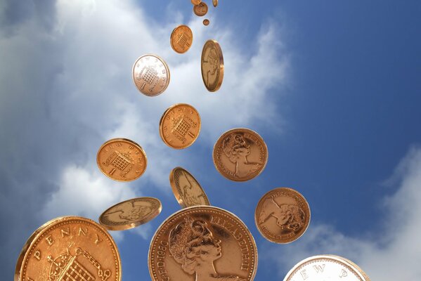 El dinero (monedas) se vierte directamente desde el cielo azul