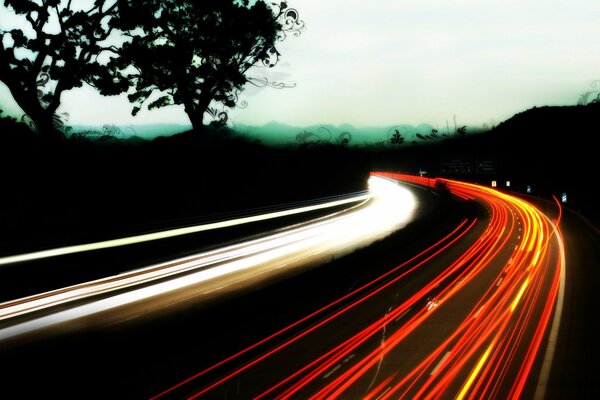 Photo of the road and the lights of cars with exposure