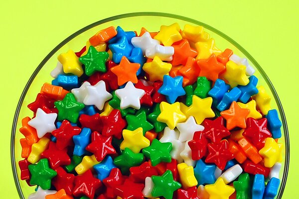 Multicolored dragee stars in a plate