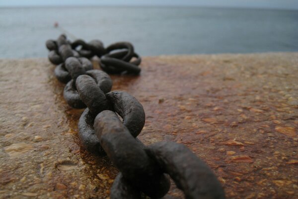 Links of the big chain on the pier