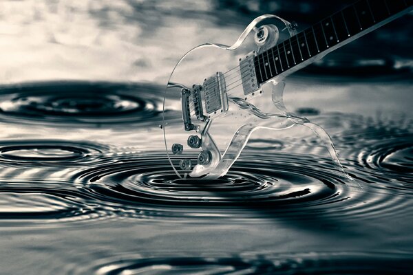 Transparent guitare. Des cercles sur l eau