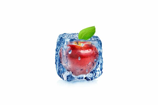 Red apple frozen in an ice cube