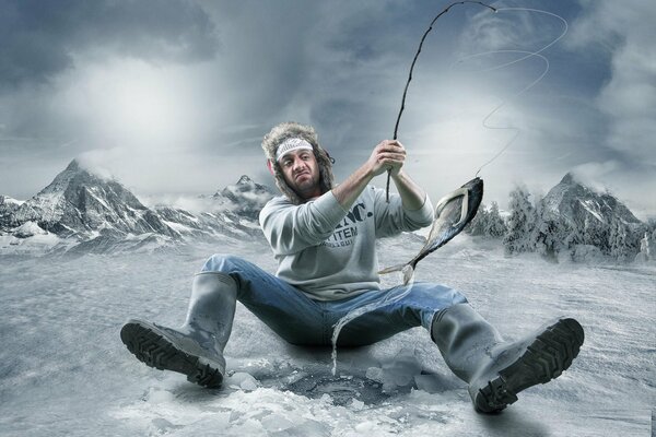 A man fishing in the winter mountains