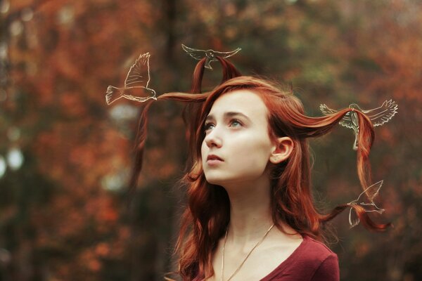 Red hair girls hold birds