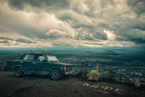 A penny against the background of a cloudy sky and a city