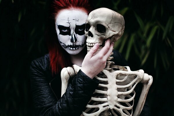 A girl with a skeleton on a black background