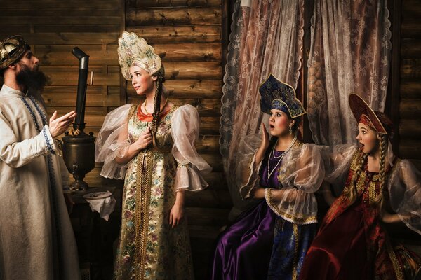 Three girls in folk costumes and the tsar