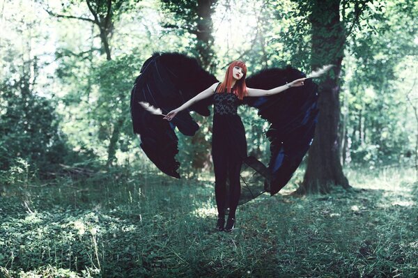 Girl with wings photo in the forest