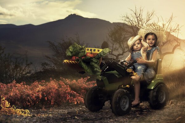 Children carry vegetables on a tractor