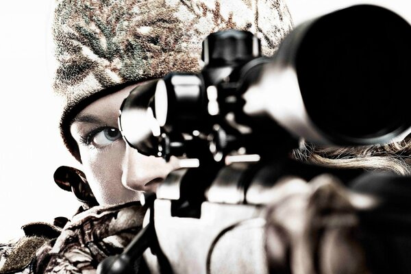 The sniper girl looks through the scope