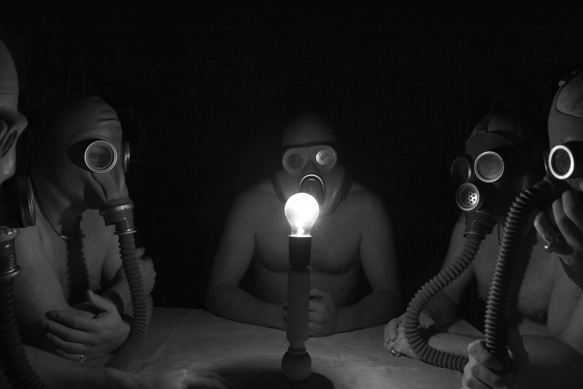 has its own atmosphere men in gas masks light twilight