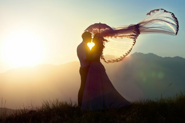 Romantic couple in the rays of the setting sun