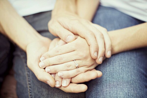 Hands with jeans with rings