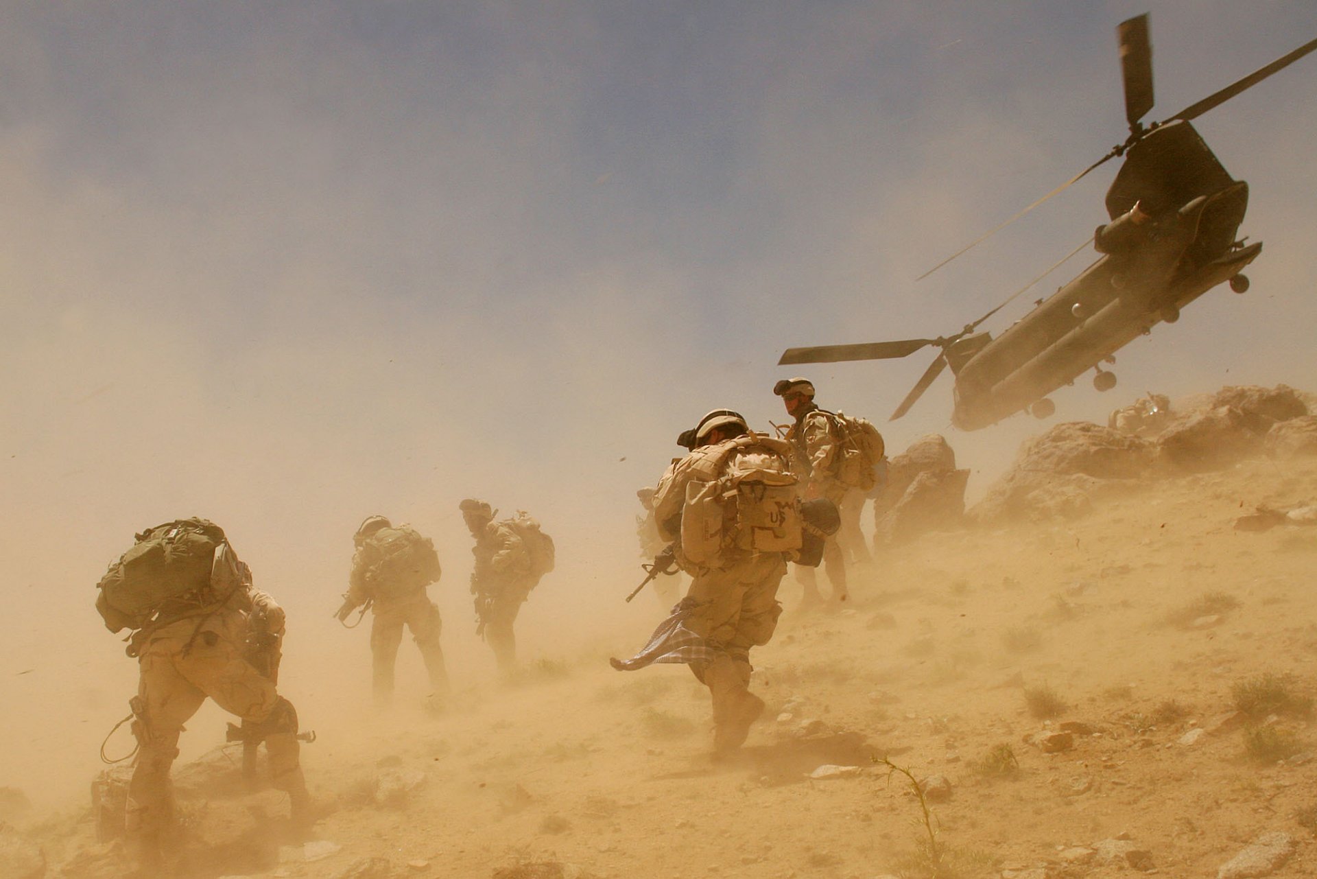 men dust wind helicopters afghanistan