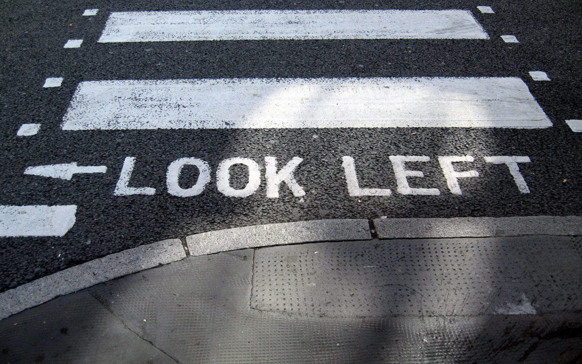 transition pavement road paint of the strip words word index inscription look left look to your left the arrow