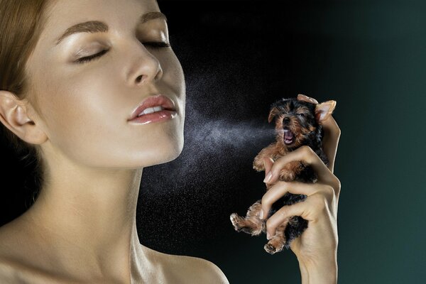 The girl uses a puppy in the form of a spray