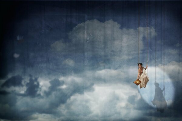 A girl on a swing in front of the scenery