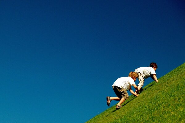 Incredibly heavy lifting of children on the green grass