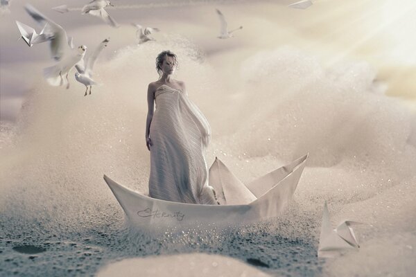 Creative photo of a girl in a paper boat