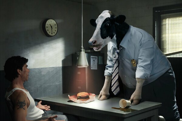 An investigator with a cow s head conducts an interrogation