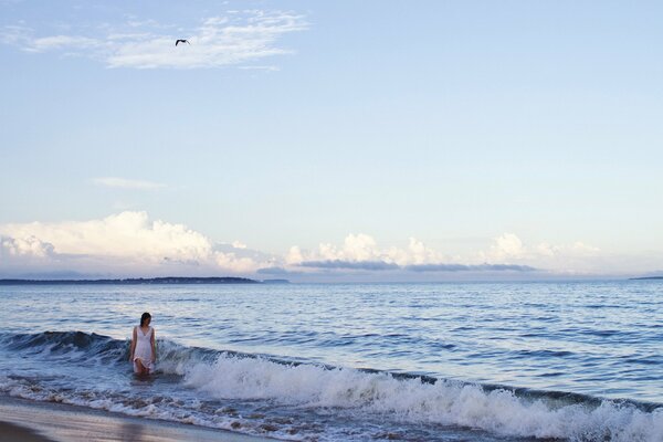 A girl in a swirling cold sea