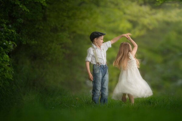 Little boy and girl dancing