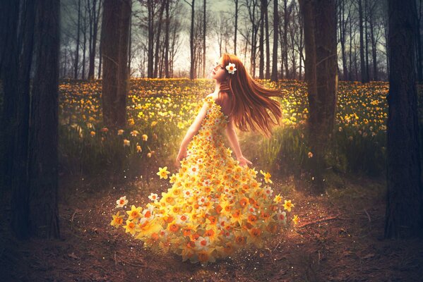 A girl in the forest in a dress made of wildflowers