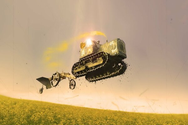 The tractor flies over the sown field